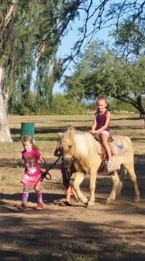 Girls love to ride a pony